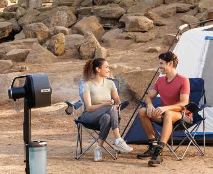 Image of man and woman camping with the Shark FlexBreeze Pro Mist
