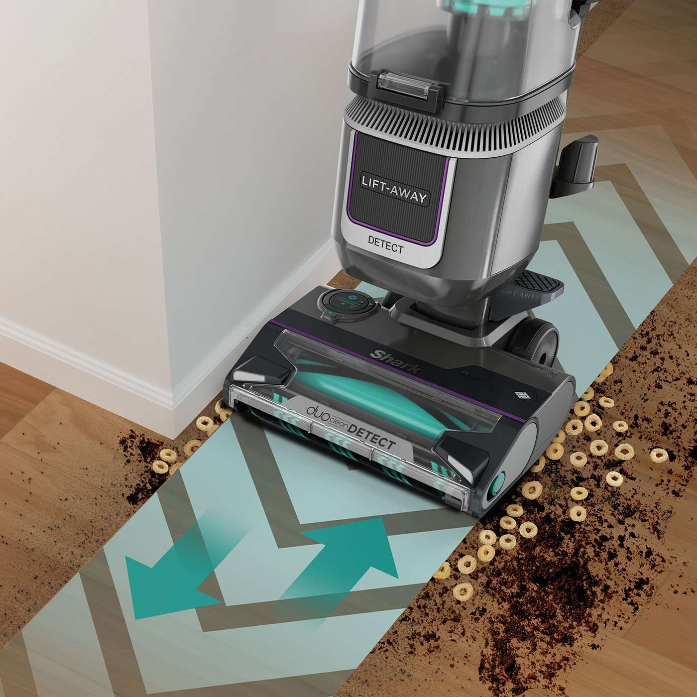 Upright vacuum cleaning cereal and dirt along a wall; overlay arrows show the suction path.